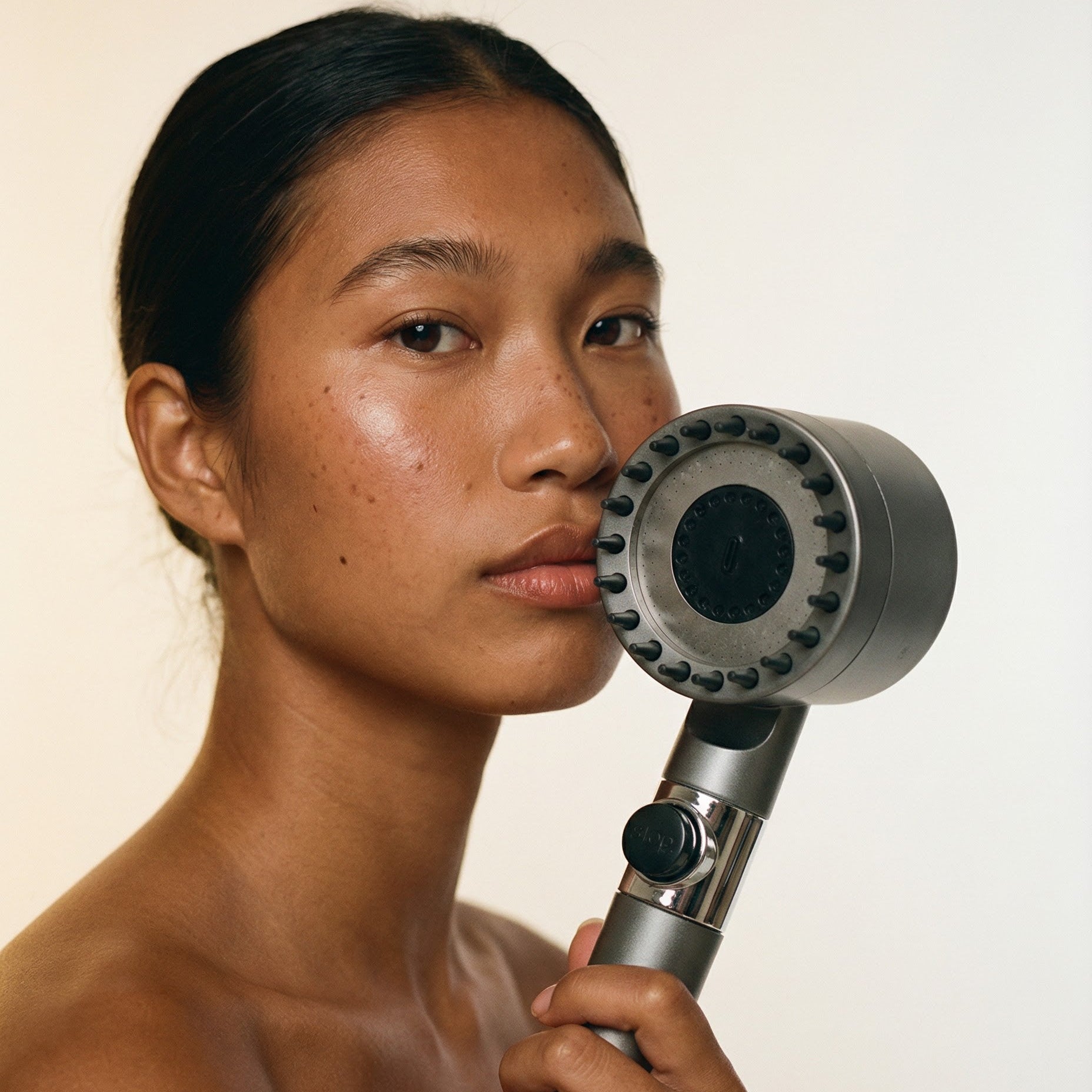 Generated_with_Kive.ai_-_with_Have_the_model_hold_the_shower_head_product.jpg